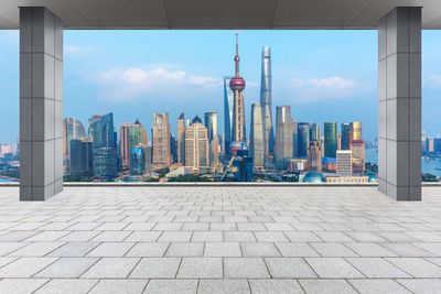 Modern buildings against cloudy sky