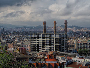 High angle view of buildings in city against sky