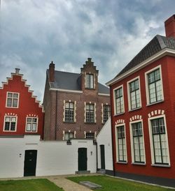 Low angle view of building against cloudy sky