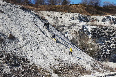 Panoramic view of people on rock