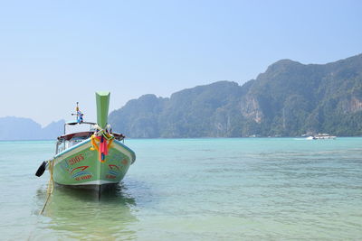 Boat in sea against clear sky