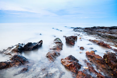 Scenic view of sea against sky during winter