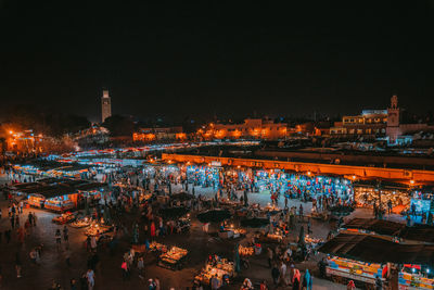 High angle view of illuminated buildings in city at night