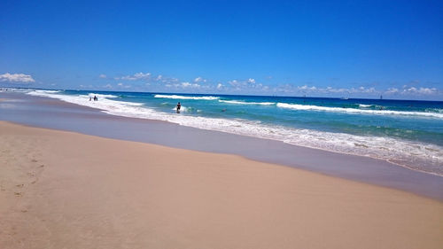 Scenic view of sea against blue sky