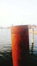 Close-up of wooden post in the lake