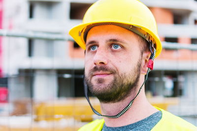 Close-up of construction worker looking away