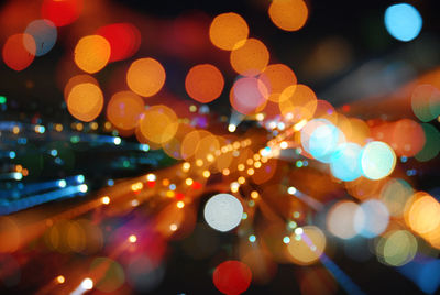 Defocused image of colorful illuminated lights at night