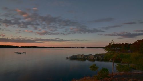 View of calm lake at sunset