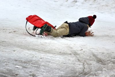 Child playing on snowy field