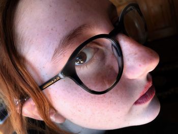 Close-up portrait of woman wearing eyeglasses