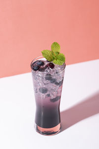 Close-up of beer glass against white background