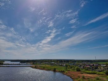 River amidst buildings against sky