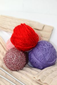 High angle view of multi colored wool balls on table at home