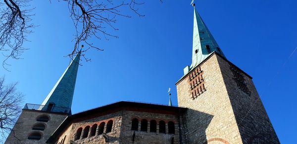 Low angle view of building against blue sky