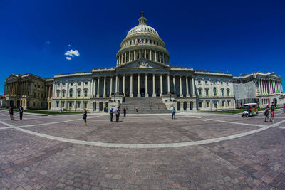 Facade of historical building against blue sky