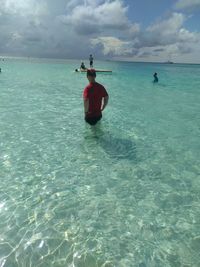 Man on sea against sky