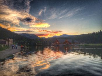 Scenic view of lake at sunset