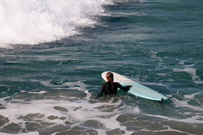 High angle view of man swimming in sea