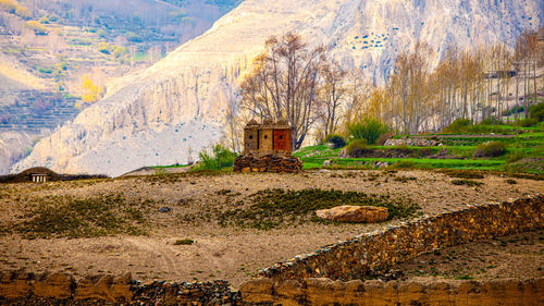 Built structure on land with mountain in background