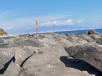 Scenic view of beach against blue sky