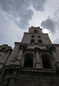 Low angle view of old building against sky