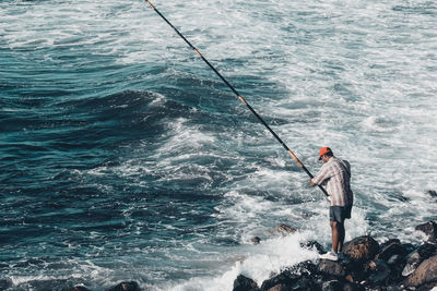 Man fishing in sea