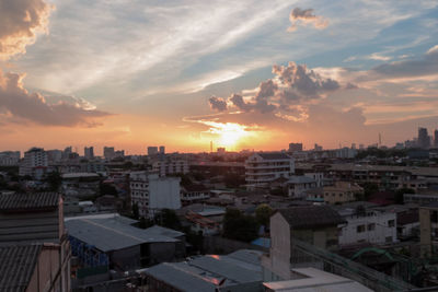 High angle view of buildings against sky during sunset