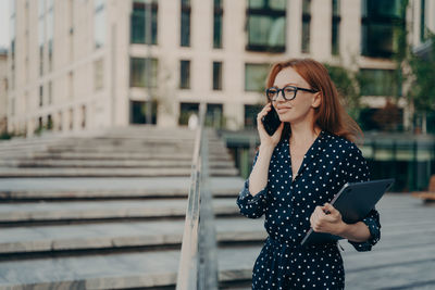 Young woman using mobile phone