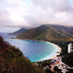 Scenic view of mountains against cloudy sky