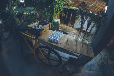 High angle view of table and chairs against trees