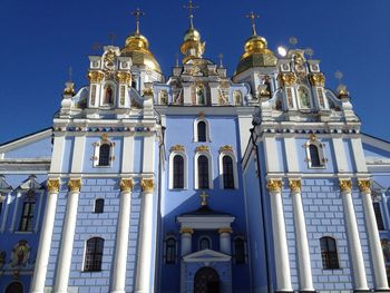 Low angle view of building against blue sky