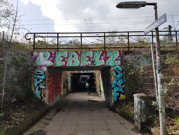 Graffiti on wall against sky