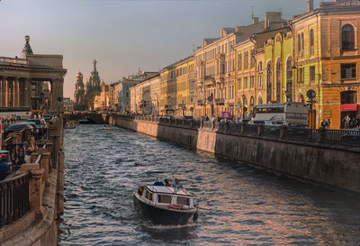 View of boat in canal at city