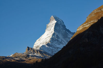 Low angle view of matterhorn mountain against clear sky