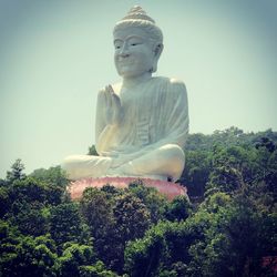 Low angle view of statue against sky