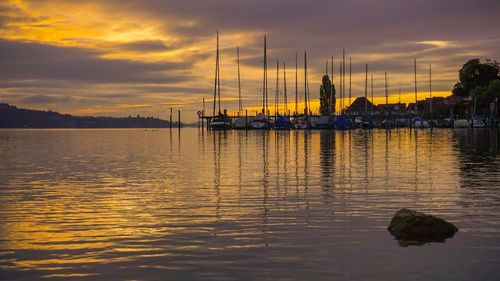 Scenic view of lake against sky during sunset
