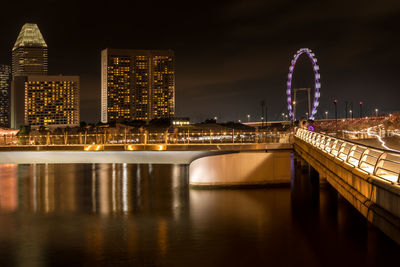 Illuminated buildings in city at night