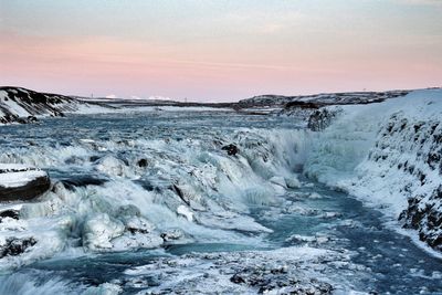 Scenic view of sea against sky during winter