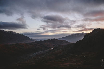 Scenic view of mountains against dramatic sky