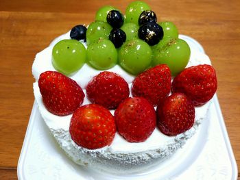 High angle view of strawberries in plate on table