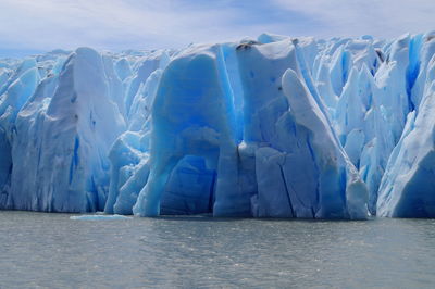 Panoramic shot of frozen sea against sky