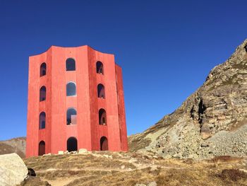 Low angle view of historical building against clear blue sky