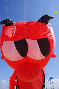 Low angle view of balloons against sky