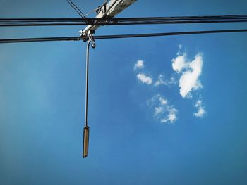 Low angle view of power lines against sky