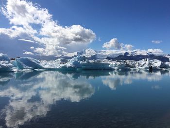 Scenic view of frozen lake against sky