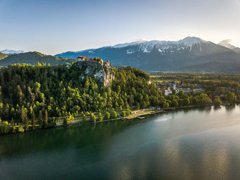 Scenic view of lake and mountains against sky