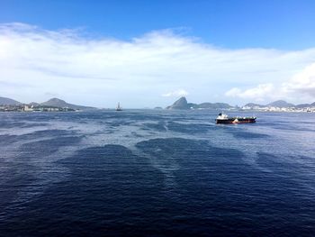 Scenic view of sea against cloudy sky