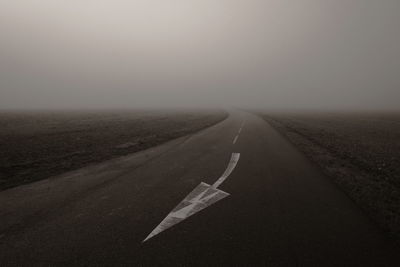 Road passing through landscape against sky