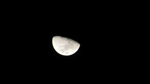 Low angle view of moon against clear sky at night