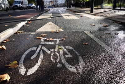 High angle view of bicycle sign on road